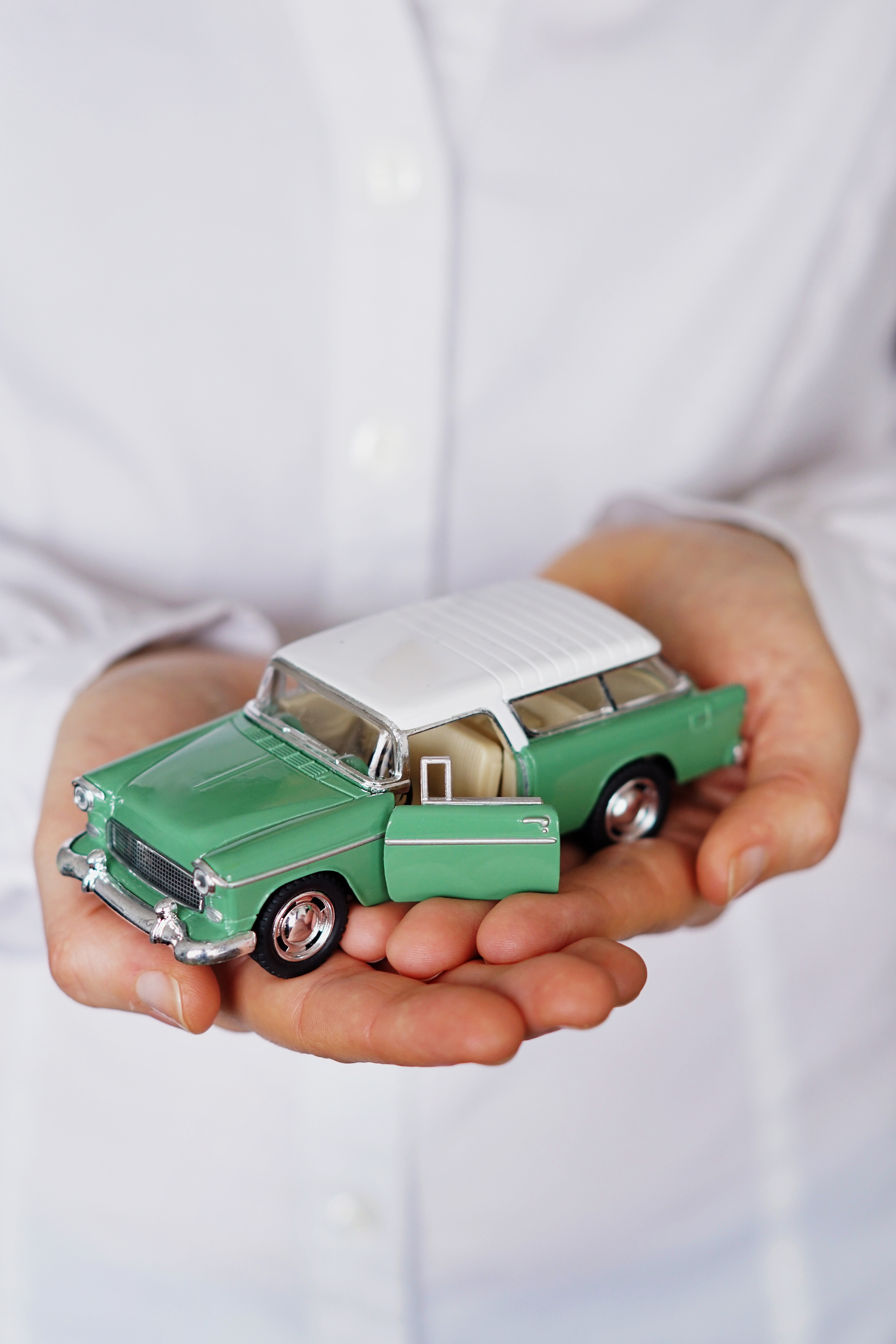 vertical-closeup-shot-person-thinking-buying-new-car-selling-vehicle